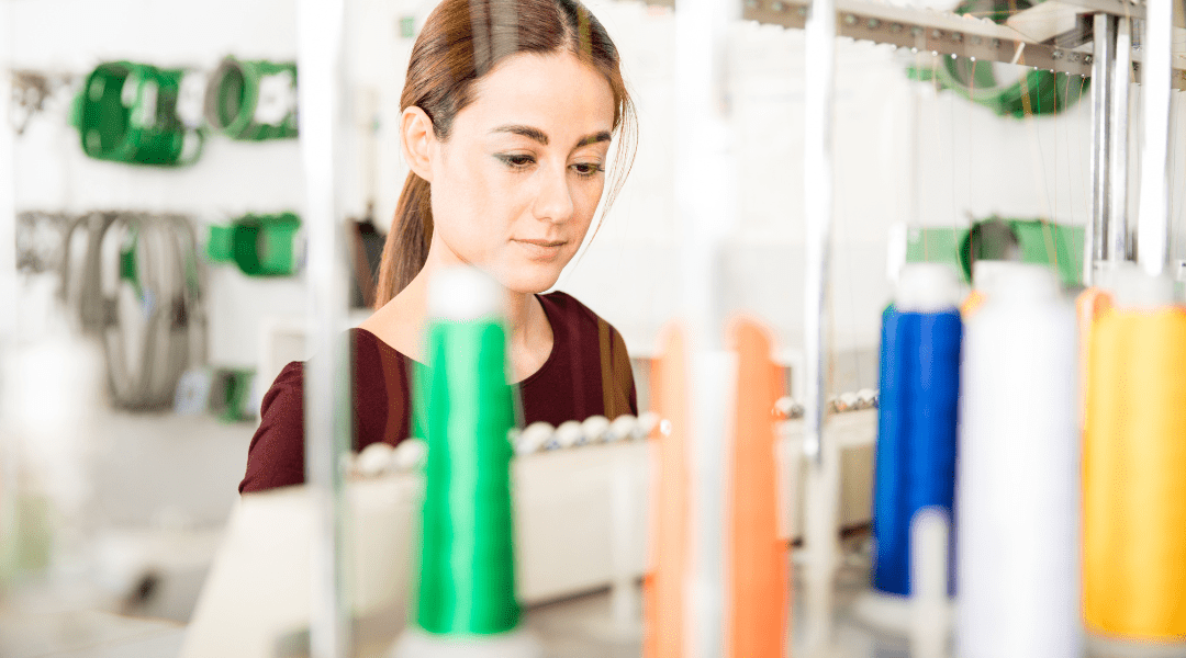 girl using embroidery machine