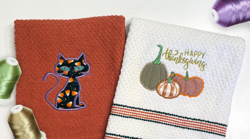 Embroidered towels with Halloween and fall applique designs – showcasing festive, seasonal motifs with intricate stitching and fabric layers.