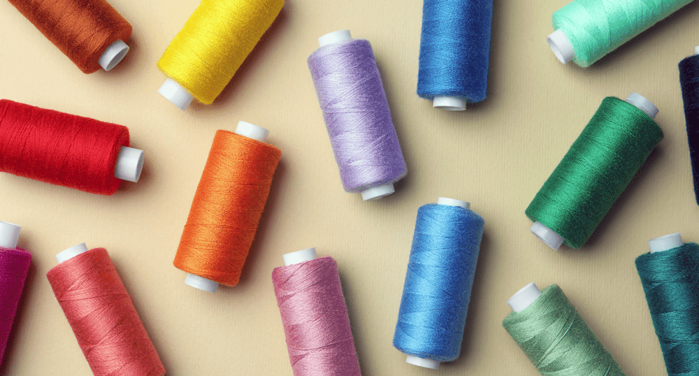 Colorful spools of thread of embroidery machines.